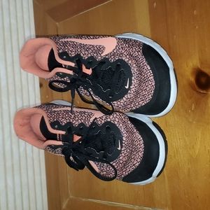Nike gym shoes, size 7.5, a black and orange pair